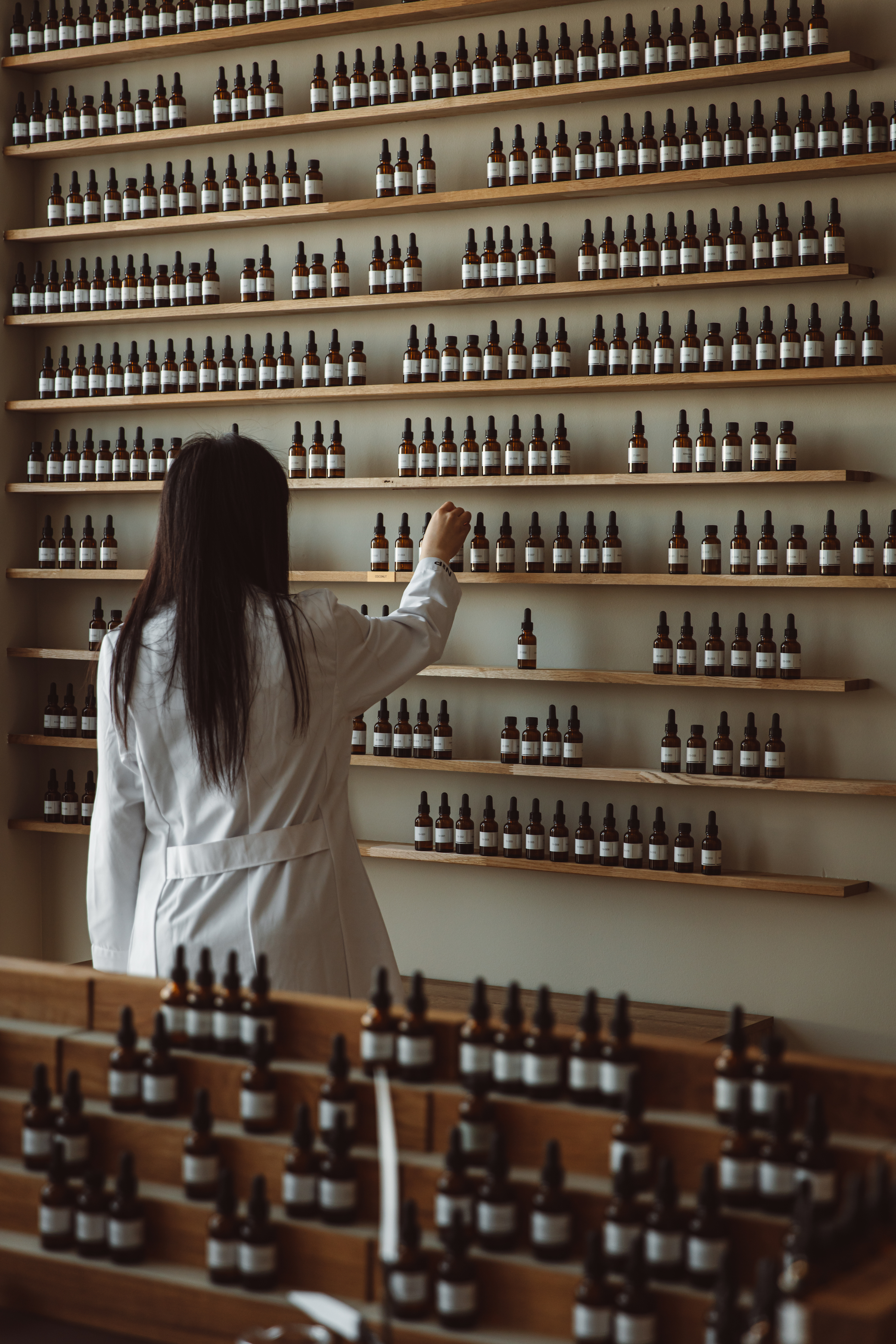 Wall of fine fragrance-grade ingredients in the Nose and Partners studio